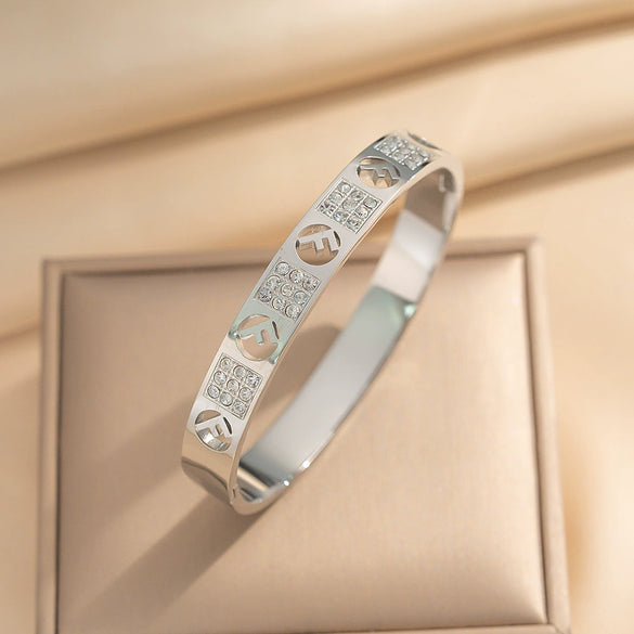 Wholesale 18K Real Gold Electroplated Zircon Letter Cut Out Buckle Titanium Steel Bracelet With Diamond Design For Women