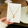 Wholesale Light Luxury Geometric Titanium Steel Cat's Eye Stone Round Pendant Necklace With Rice Chain For Women Real Gold Plated