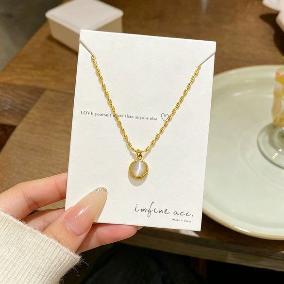 Wholesale Light Luxury Geometric Titanium Steel Cat's Eye Stone Round Pendant Necklace With Rice Chain For Women Real Gold Plated