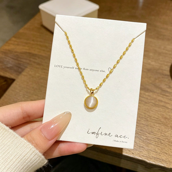 Wholesale Light Luxury Geometric Titanium Steel Cat's Eye Stone Round Pendant Necklace With Rice Chain For Women Real Gold Plated