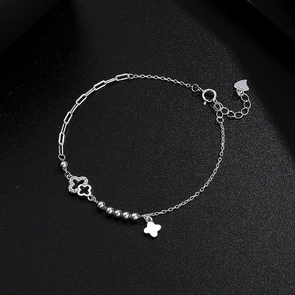 Wholesale Light Luxury Women's S925 Sterling Silver Fourleaf Clover Irregular Bracelet With Tassel And Flower Design Electroplated