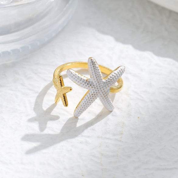 Wholesale Minimalist Fashion Stainless Steel Starfish Round Ring For Women With White Oil Dropping And Electroplating