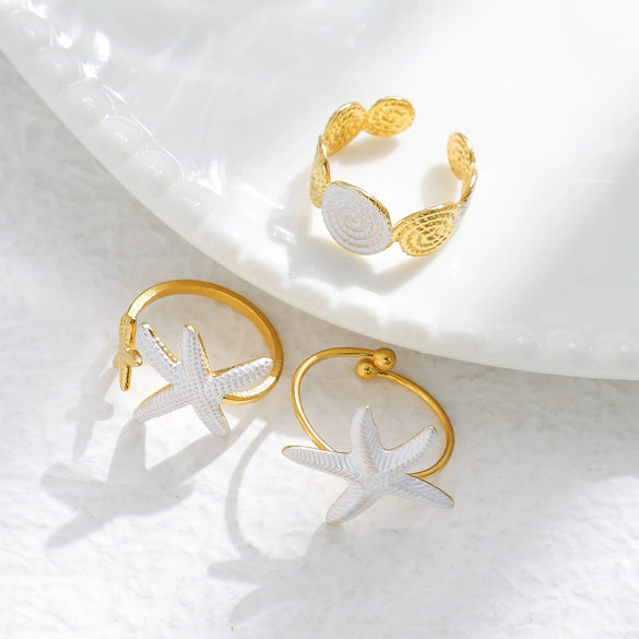 Wholesale Minimalist Fashion Stainless Steel Starfish Round Ring For Women With White Oil Dropping And Electroplating