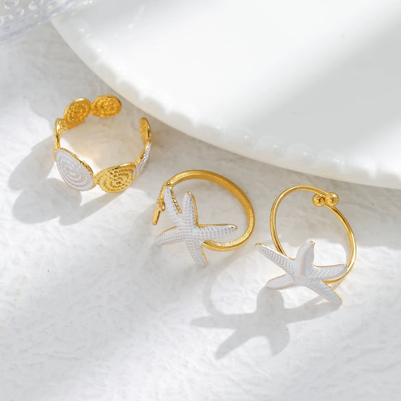 Wholesale Minimalist Fashion Stainless Steel Starfish Round Ring For Women With White Oil Dropping And Electroplating