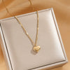 Wholesale Minimalist Heart Shape Titanium Steel Women's Necklace With Cross Chain And Electroplating Treatment