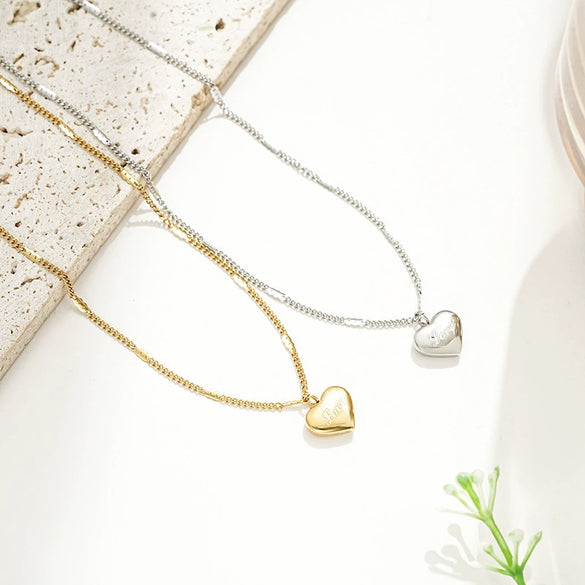 Wholesale Minimalist Heart Shape Titanium Steel Women's Necklace With Cross Chain And Electroplating Treatment