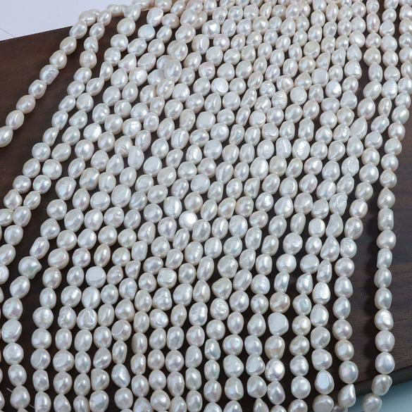 Wholesale Naked Freshwater Pearls Doublesided Light Baroque Shaped String