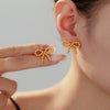 Wholesale Niche Design Round Ball Stitching Bow Style Titanium Steel Earrings Plated With 18K Gold For Women