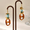 Wholesale Oval Resin And Stainless Steel Geometric Pig Nose Earrings For Women With Electroplating Design