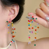 Wholesale Plastic Resin Handmade Flower Tassel Earrings With Silver Needle In Small Fresh Style