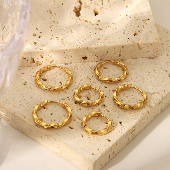 Wholesale Simple Light Luxury Twist Titanium Steel Earrings With Pvd Furnace Real Gold Electroplating