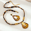 Wholesale Stainless Steel And Titanium Steel Leopard Print Electroplated Braided Rope And Sweater Chain Necklace For Women