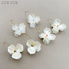 Wholesale Stainless Steel French Retro Flower Earrings With Imitation Shell And Electroplating Treatment