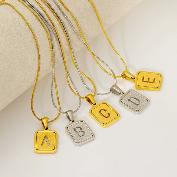 Wholesale Stainless Steel Necklace With Electroplating 26 Letters Pendant And New Sand Pressing Process Snake Chain Design