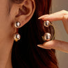 Wholesale Stainless Steel Vintage Arc Hollow Ball Earrings For Women With Electroplating Treatment