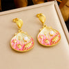 Wholesale Stainless Steel Women's Cartoon Geometric Dripping Oil Ocean Wind Pendant Earrings With Scallop Starfish Shell