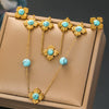 Wholesale Stainless Steel Women's Jewelry Set With Fourpetal Flower Pattern And Turquoise Inlay Electroplated Treatment