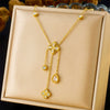 Wholesale Stainless Steel Women's Light Luxury Diamond Water Drop Fourpetal Flower Pendant Collarbone Necklace With Rhinestones And Electroplating