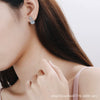 Wholesale 925 Sterling Silver Women's Fourclaw Square Bag Earrings With Flower Pattern And Electroplating Treatment