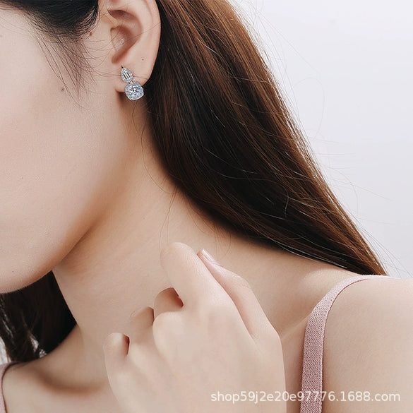Wholesale 925 Sterling Silver Women's Fourclaw Square Bag Earrings With Flower Pattern And Electroplating Treatment