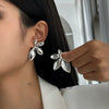 Wholesale Stud Earrings Zinc Alloy Geometric Irregular Fold Corrugated Smooth Petal Bow Style With Stainless Steel Ear Needles And Electroplating