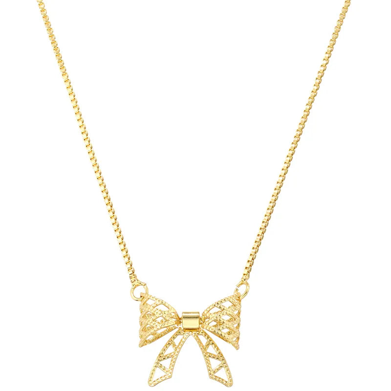 Wholesale Sweet Bow Knot Copper Hollow Out 18K Gold Plated Zircon Pendant Necklace