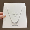 Wholesale Titanium Steel And Alloy Small Flower Pendant Necklace With Diamond Design For Women