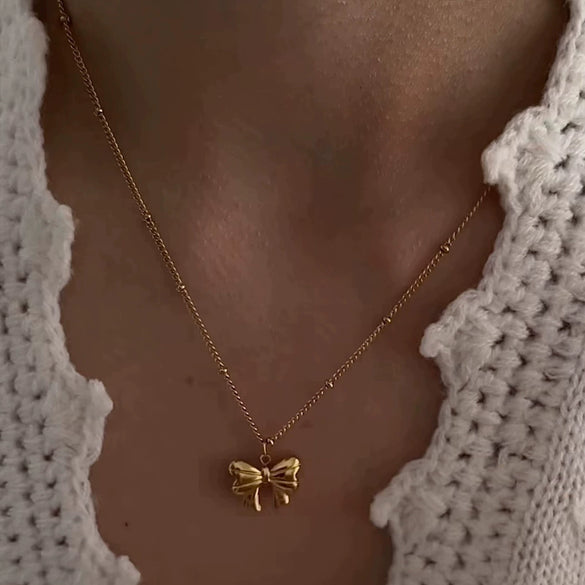 Wholesale Titanium Steel Bow Pendant Necklace For Women With 18K Gold Plating