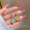 Wholesale Titanium Steel Golden Clover Necklace With Mixed Gem Inlay And Twisted Chain For Women