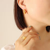 Wholesale Titanium Steel Goldplated Geometric Cshaped Earrings With Inlaid Imitation Pearl Zircon