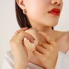 Wholesale Titanium Steel Goldplated Geometric Cshaped Earrings With Inlaid Imitation Pearl Zircon