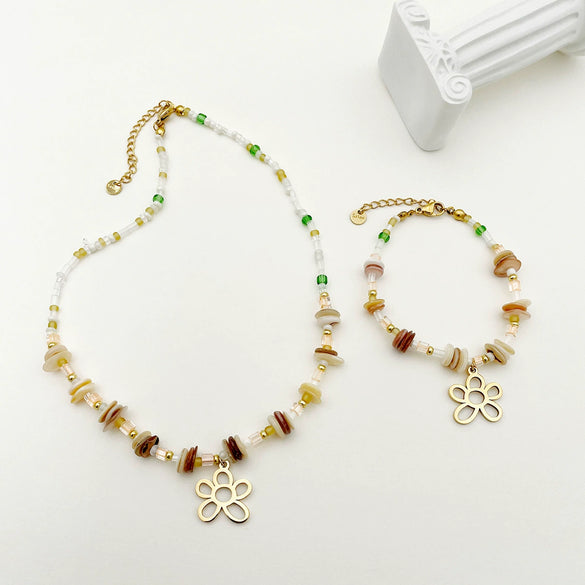 Wholesale Titanium Steel Irregular Hollow Flower Handmade Beaded Necklace And Bracelet Set With Electroplating For Women