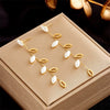 Wholesale Titanium Steel Pearl Hollow Leaf Long Hanging Earrings For Women With Electroplating Design