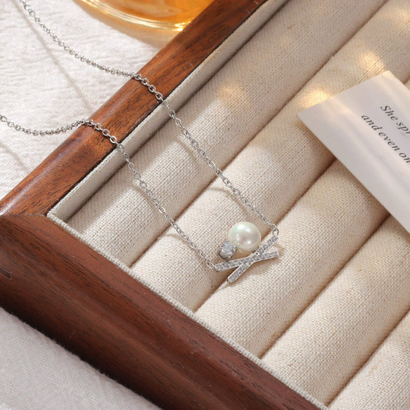 Wholesale Titanium Steel Women's Geometric Bowknot Necklace With Electroplating And O Word Chain
