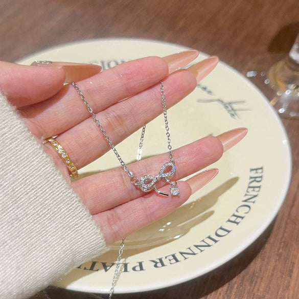 Wholesale Titanium Steel Zircon Inlaid Bow Pendant Necklace For Women