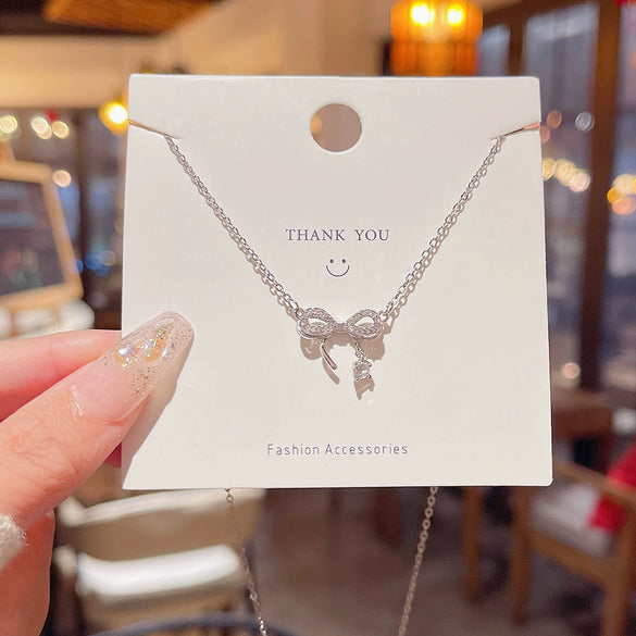 Wholesale Titanium Steel Zircon Inlaid Bow Pendant Necklace For Women
