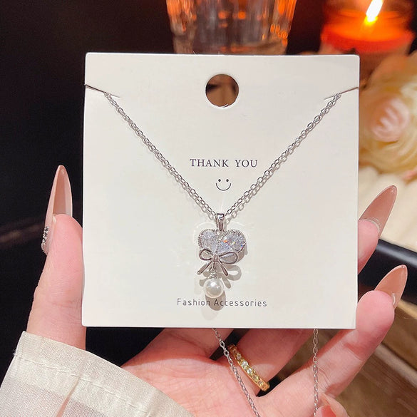 Wholesale Titanium Steel Zircon Inlaid Bow Pendant Necklace For Women