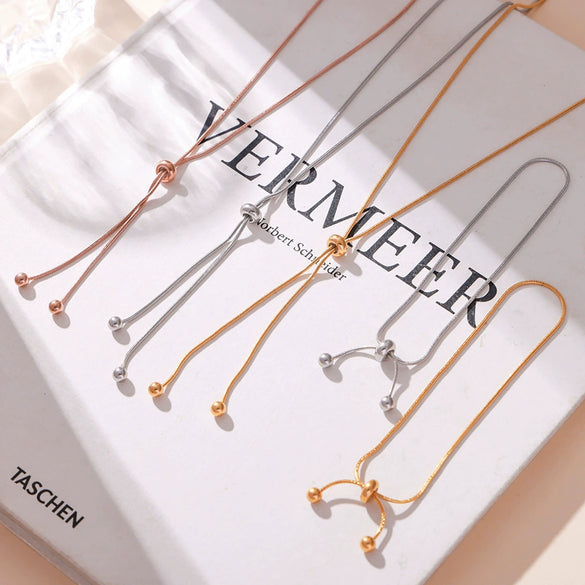 Wholesale Unisex Fashion Geometric Round Bead Pull Buckle Tassel Titanium Steel Electroplated 18K Gold Jewelry Set Of Necklace Bracelet And Anklet
