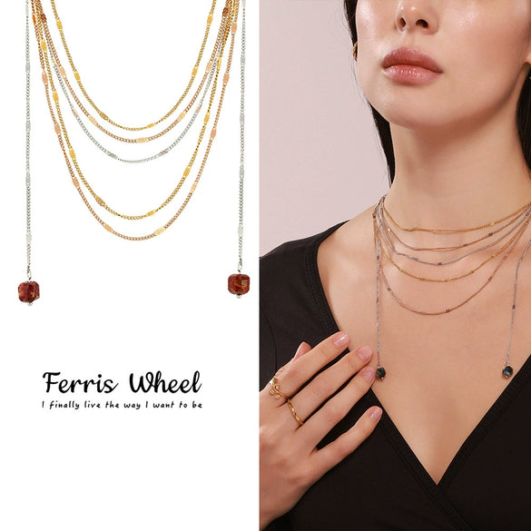 Wholesale Unisex Simple Geometric Ferris Wheel Cutout Volcanic Stone Tassel Titanium Steel Electroplated Necklace