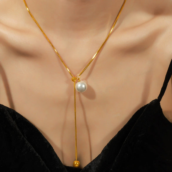 Wholesale Unisex Simple Geometric Titanium Steel Electroplated Necklace With Snake Chain And Round Bead Tassel Pendant
