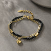 Wholesale Unisex Titanium Steel Black Beaded Bracelet With 14K Goldplated Electroplated Design