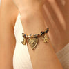 Wholesale Vintage Printed Stainless Steel Goldplated Irregular Heartshaped Flower Pendant Bracelet For Women
