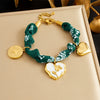 Wholesale Women's Accessories Retro Printed Stainless Steel Electroplated Heart Water Drop Bell Shaped Necklace Bracelet Suit