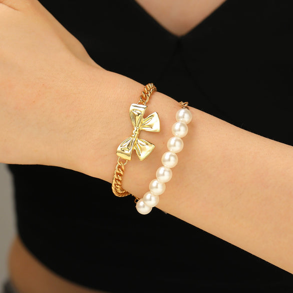 Wholesale Women's Alloy Beaded Bracelet With Irregular Imitation Pearl Stitching And Bow Tie Pendant Electroplating Design