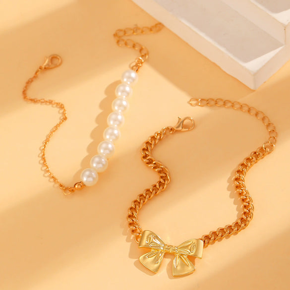 Wholesale Women's Alloy Beaded Bracelet With Irregular Imitation Pearl Stitching And Bow Tie Pendant Electroplating Design