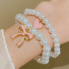 Wholesale Women's Alloy Beaded Bracelet With Irregular Imitation Pearl Stitching And Bow Tie Pendant Electroplating Design