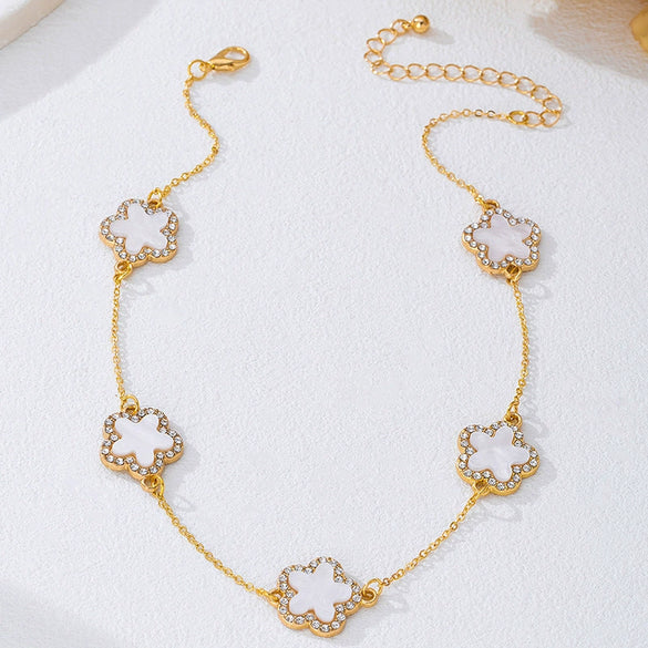 Wholesale Women's Alloy Electroplated Flowershaped Anklet With Diamond Encrusted Fourleaf And Fiveleaf Clover Pendants In Sweet And Cool Style