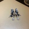 Wholesale Women's Alloy Flower Earrings With Diamond And Pearl Design Retro Fashion Temperament