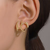 Wholesale Women's Alloy Geometric Irregular Liquid Hollow Electroplated Earrings