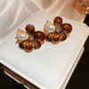 Wholesale Women's Alloy Geometric Maillard Style Earrings With Silver Needle And Electroplating